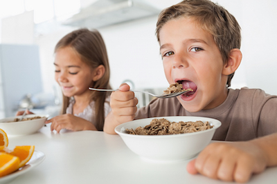 Young Boy Eating Cereal