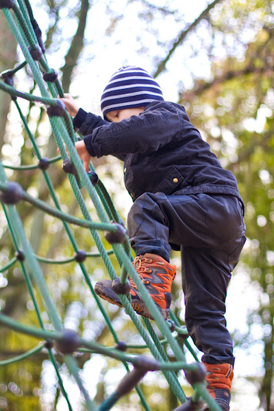 Boy Climbing on Playground