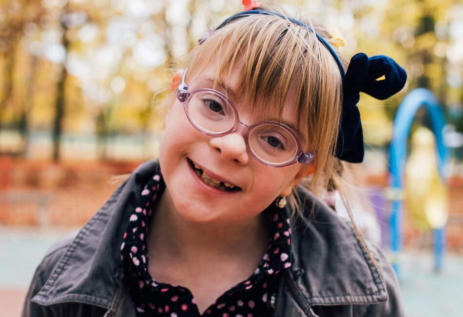 girl with glasses at outdoor playground