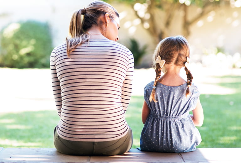 woman sitting with little girl