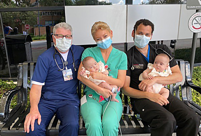 Physicians holding babies