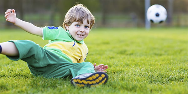 young boy playing soccer