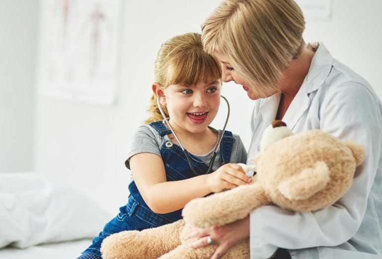Doctor and little girl with stethoscope