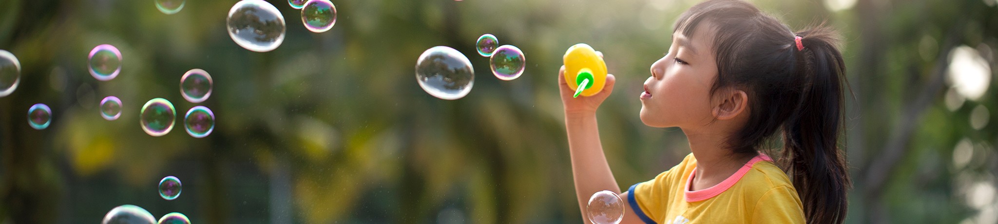 Girl blowing bubbles