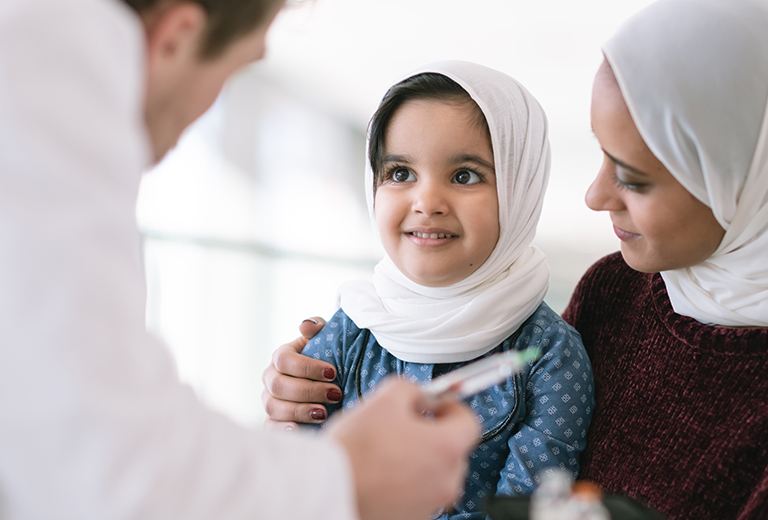 Mother and daughter visiting the doctor