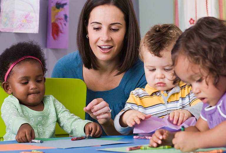 Kids drawing with crayons