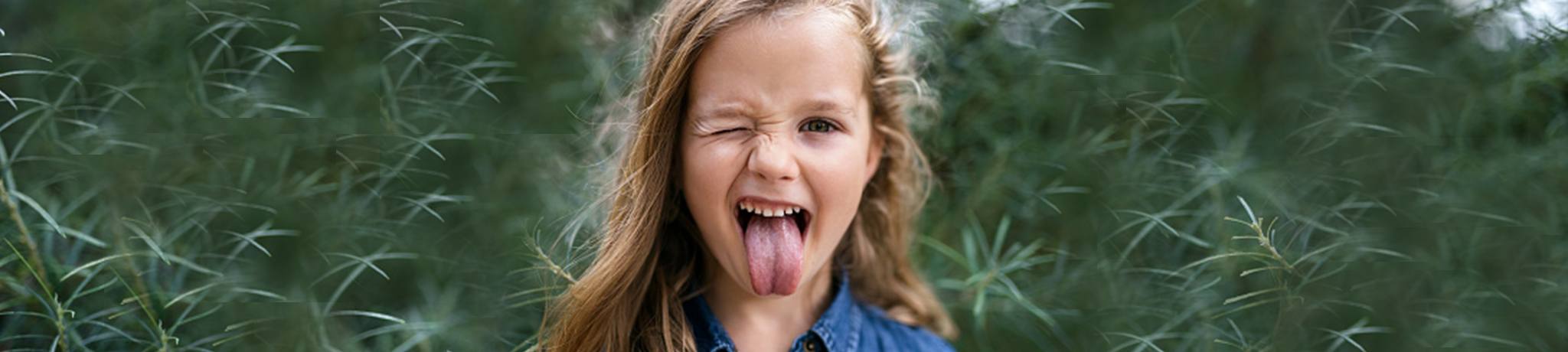 Girl winking and sticking out tongue