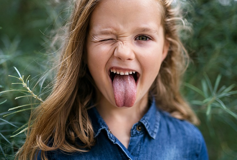 Girl winking and sticking out tongue