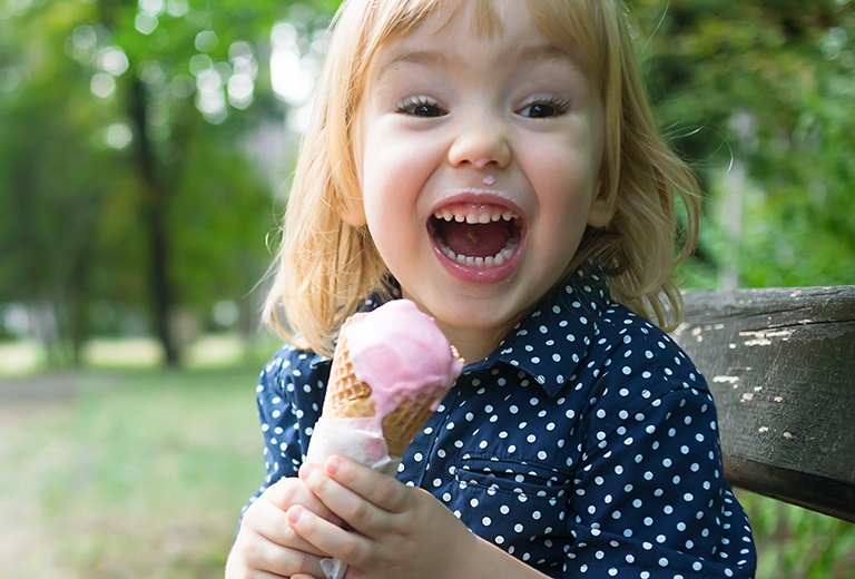 Girl smiling with ice cream