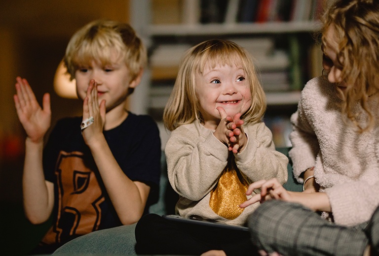 Two kids clapping