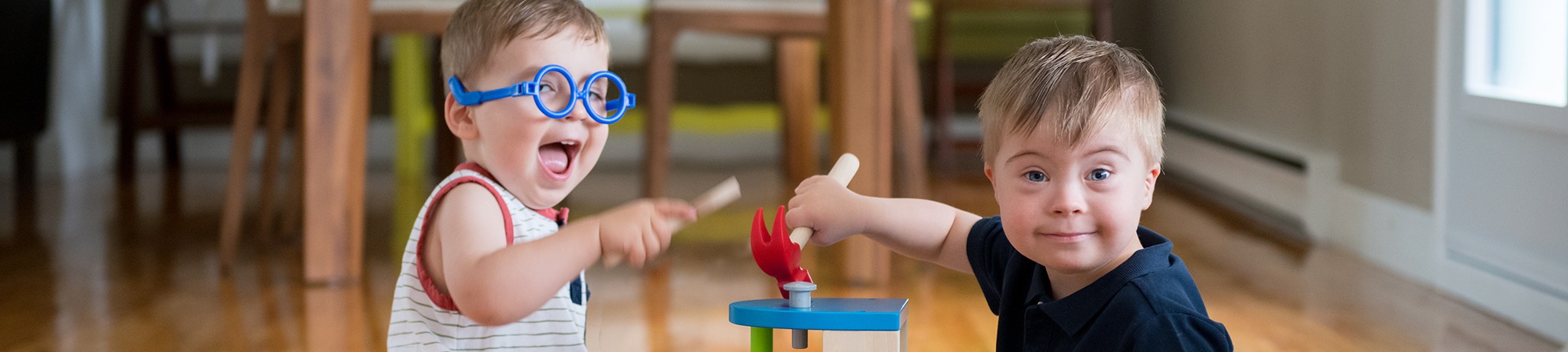 Two boys playing with building toys