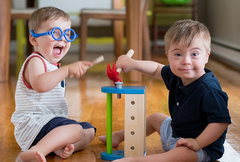Two boys playing with building toys