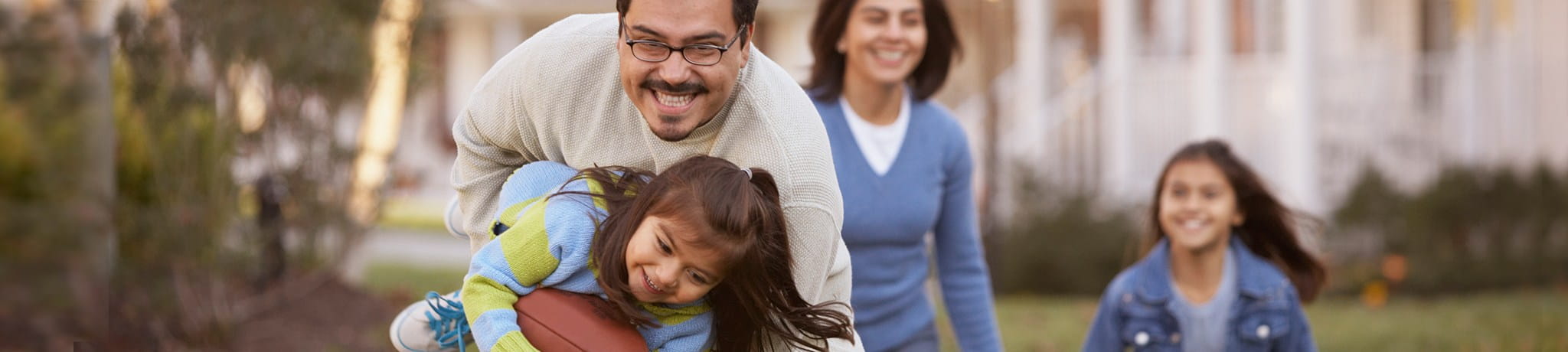 Family playing with football