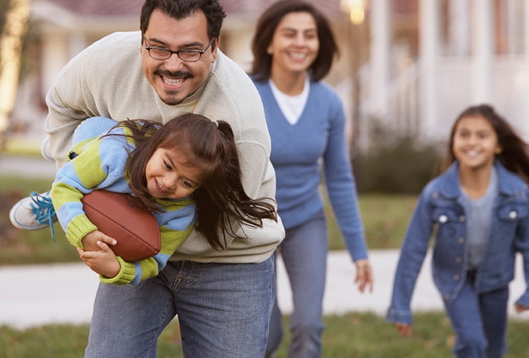 Family playing with football