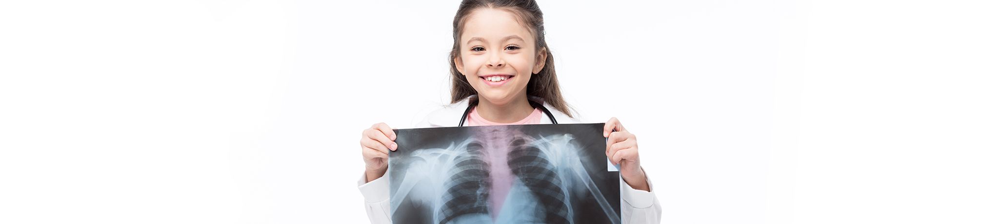 Girl dressed as doctor holding image of x-ray