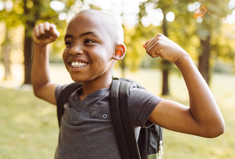 Boy flexing muscles