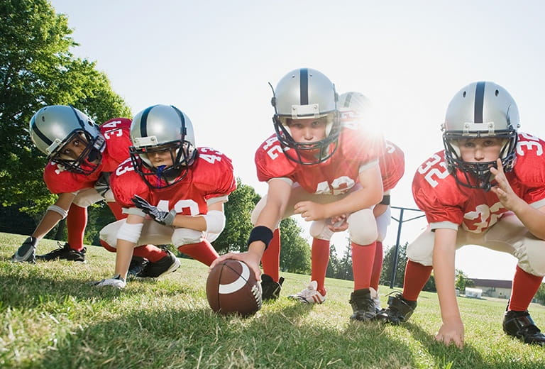 Kids playing football