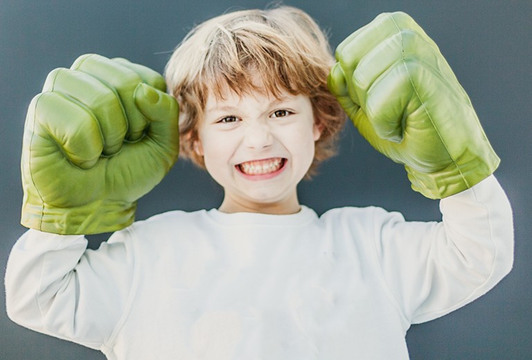 Boy wearing Hulk hands