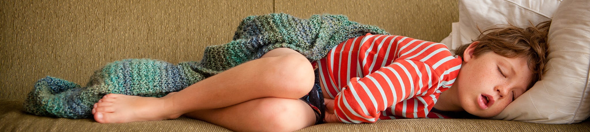 Child sleeping on couch