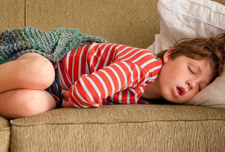 Child sleeping on couch