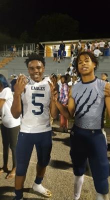 DJ and teammate on football field