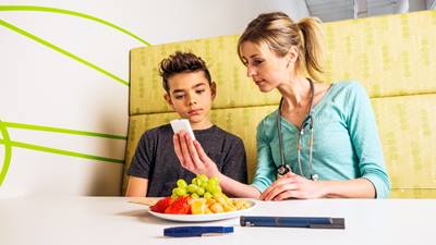 Doctor teaches boy about prediabetes