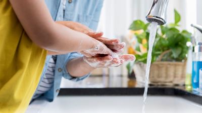 Parent and child washing their hands