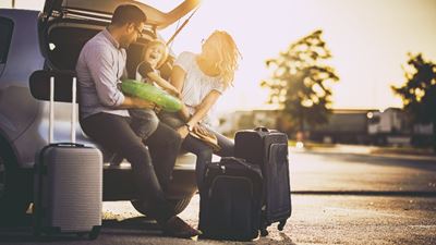 Family in trunk with luggage