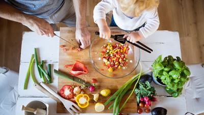 Father and son preparing healthy meal