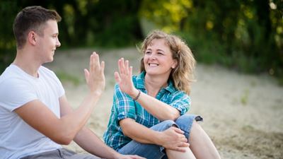 Mother and son high-fiving