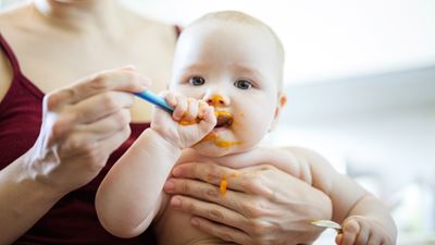 Mother feeding baby