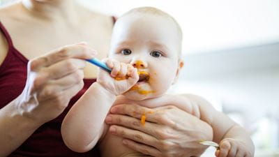 Mother feeding baby