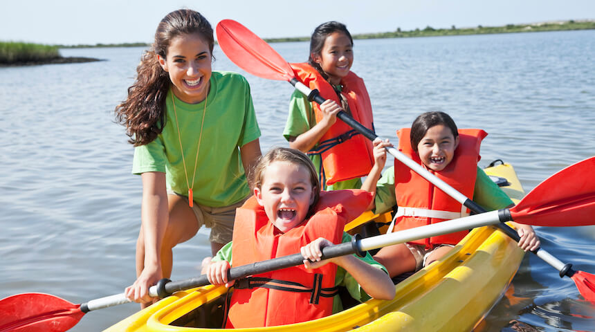 Kids at summer camp in kayak
