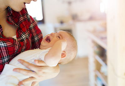 Mom Holding Crying Baby