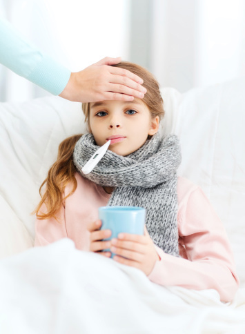 Girl in Bed with Thermometer