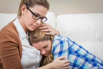 Mom Comforting Teenage Girl