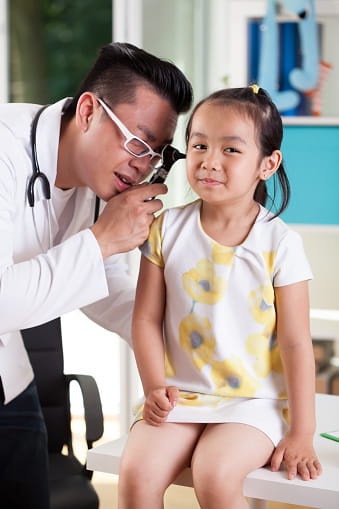 Asian girl with ear infection