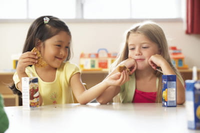 Girl Sharing Lunch at School