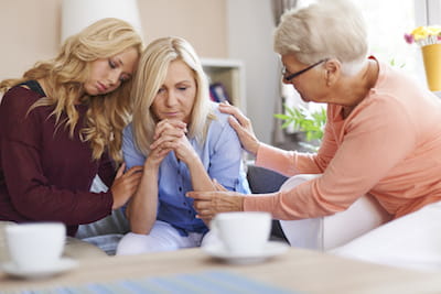 Family of Women Comforting each other in grief