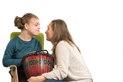 Girl with Drum in Music Therapy