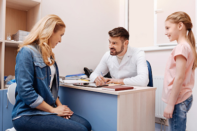 Mom Receiving Advice from Pediatrician