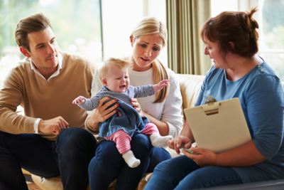 Social Worker Meeting with New Parents
