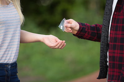 Teenage Girl Buying Drugs