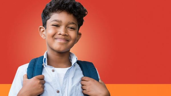 Boy smiling with backpack