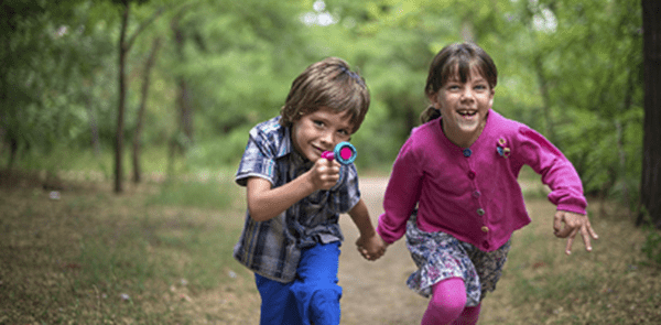 Kids running in the woods