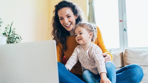 Mother and daughter looking at computer