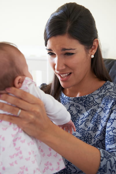 Frustrated Mom Holding Baby