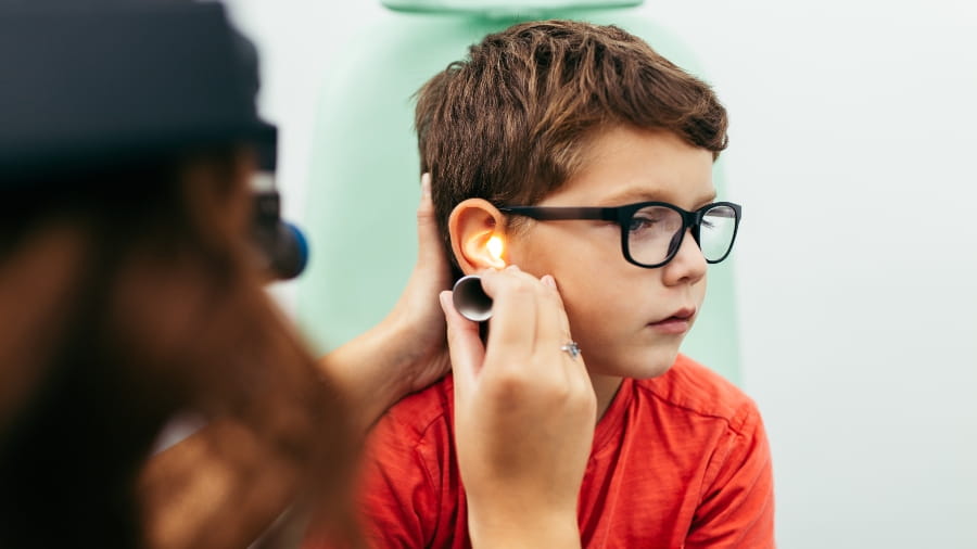 Ear exam on boy