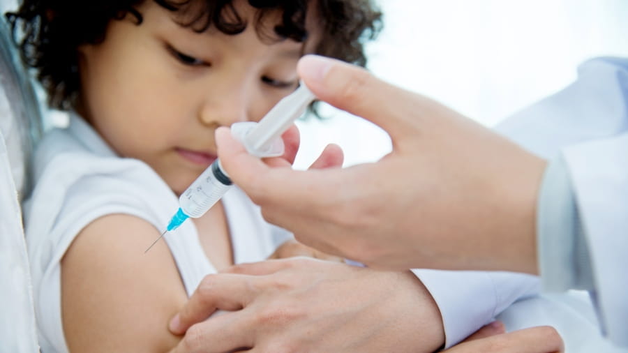 Boy getting flu shot