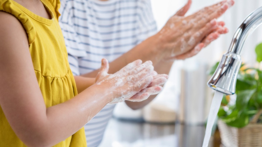 Parent and child washing hands